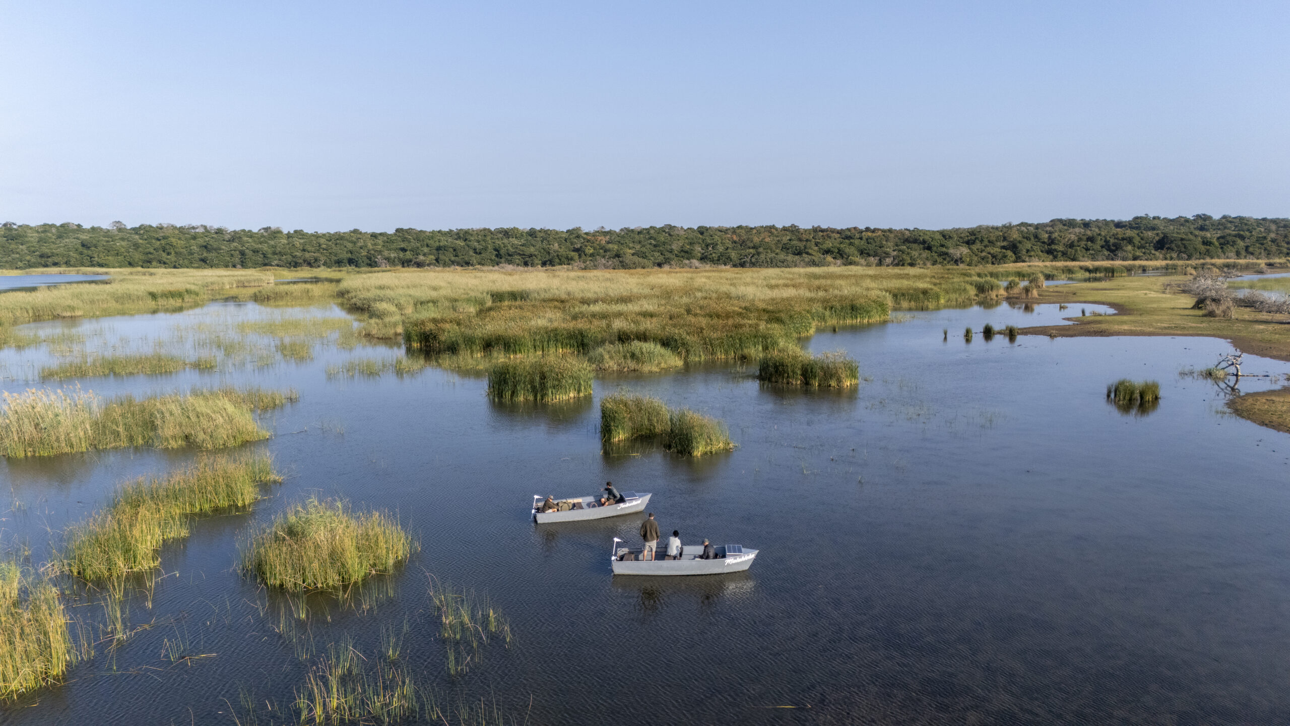 2 boats on a lake