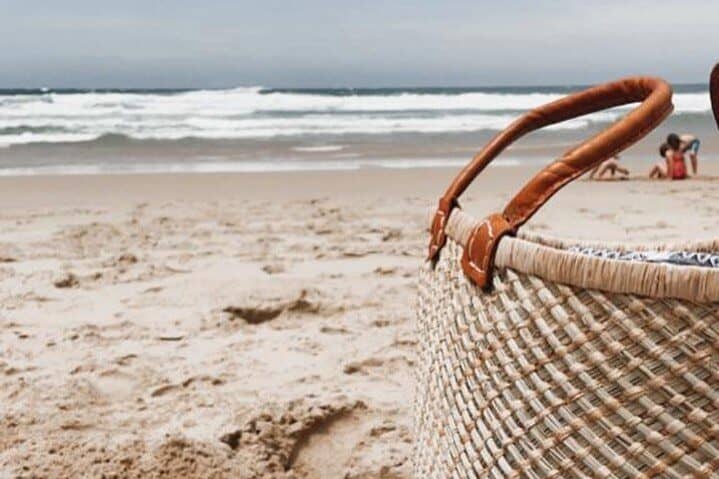 beach with picnic basket in foreground