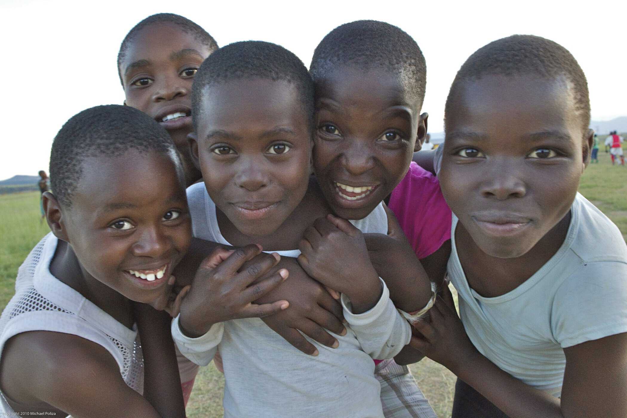 kids from creche smiling at camera