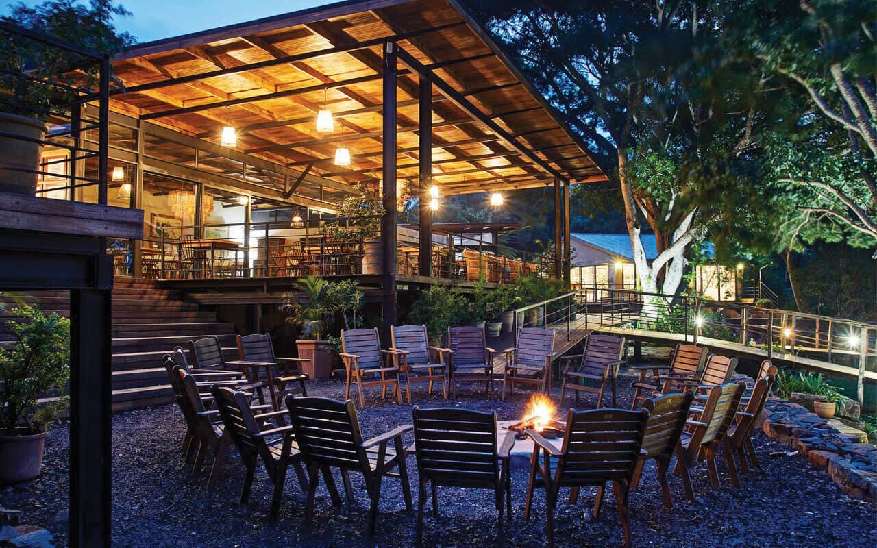 circle of chairs around a fire pit