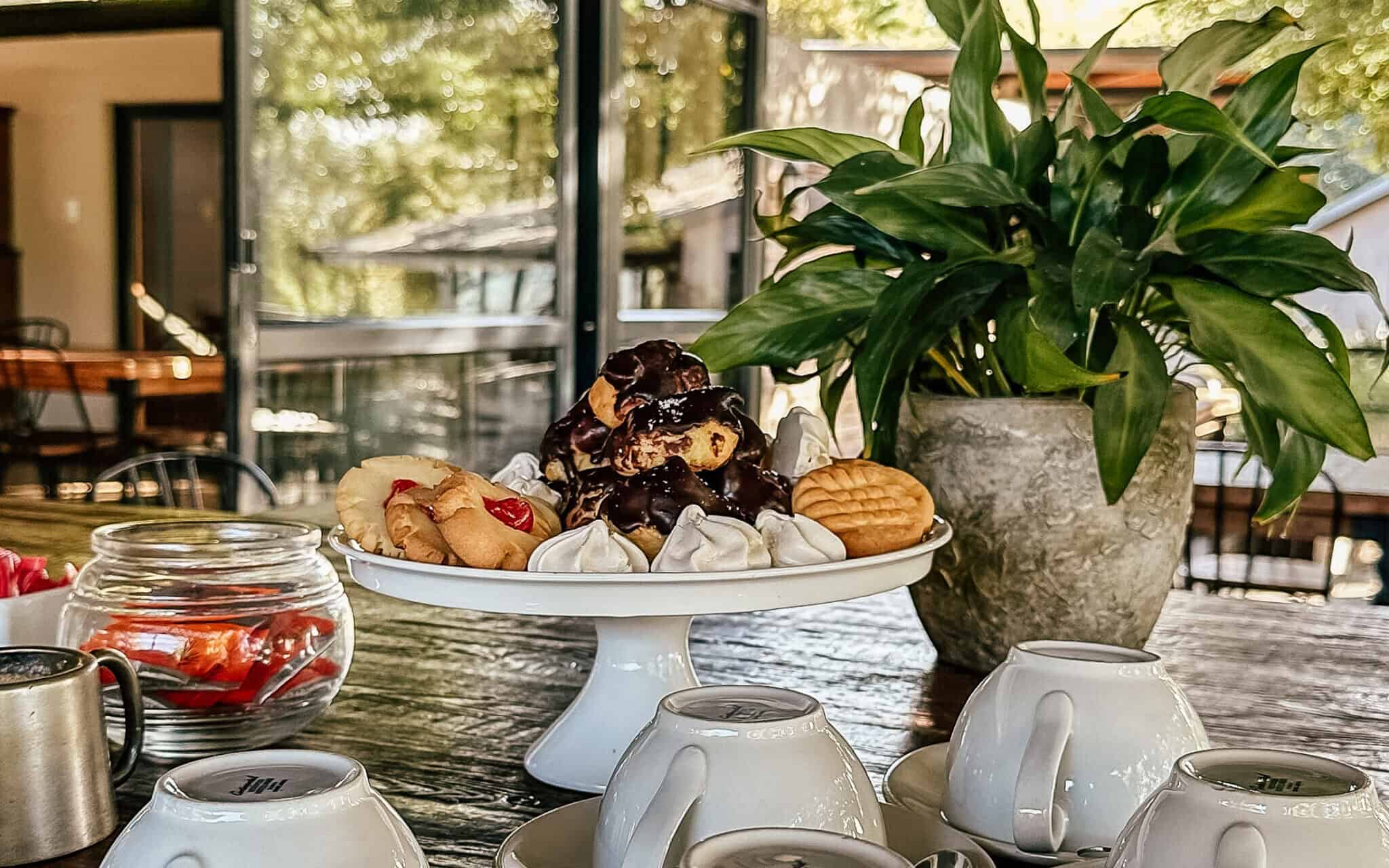 platter of sweet treats and tea cups