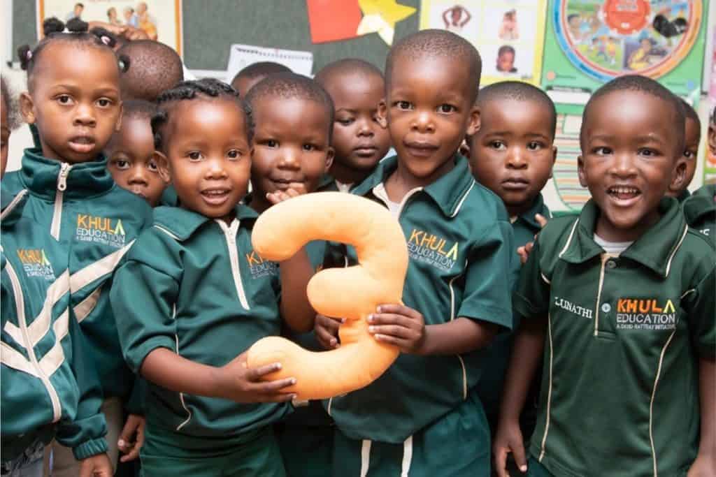 children standing in school uniform