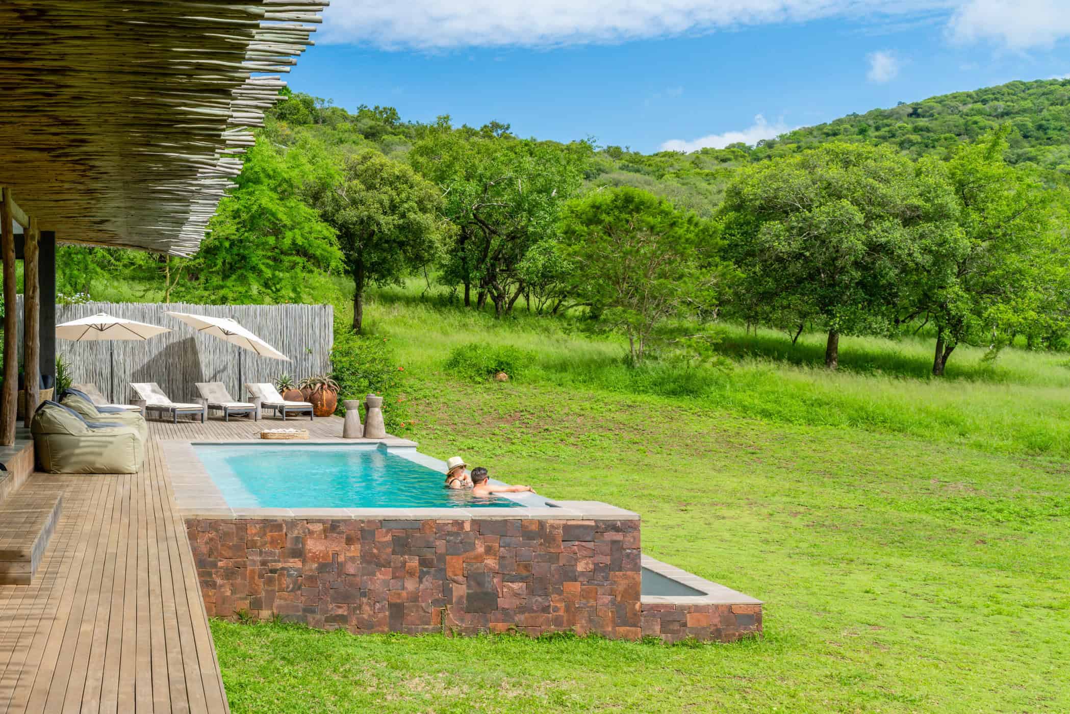 guests standing in swimming pool