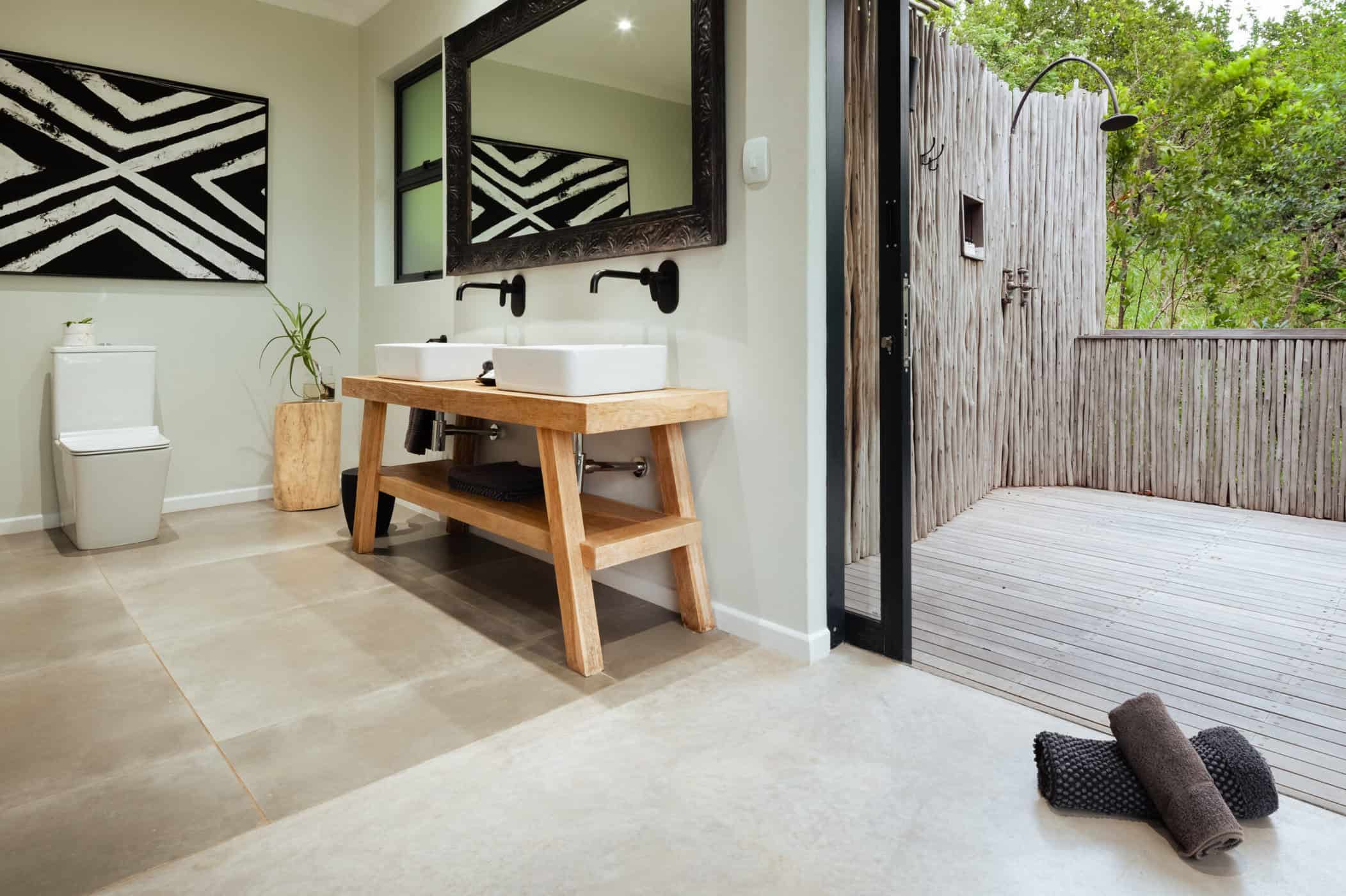 bathroom sink next to outdoor shower