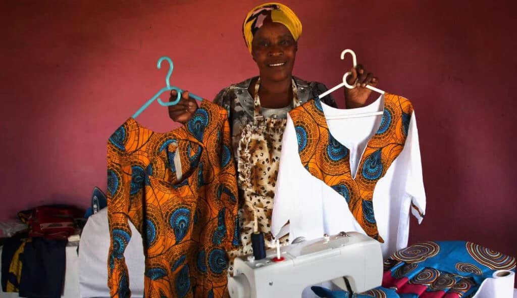 lady standing selling shirt