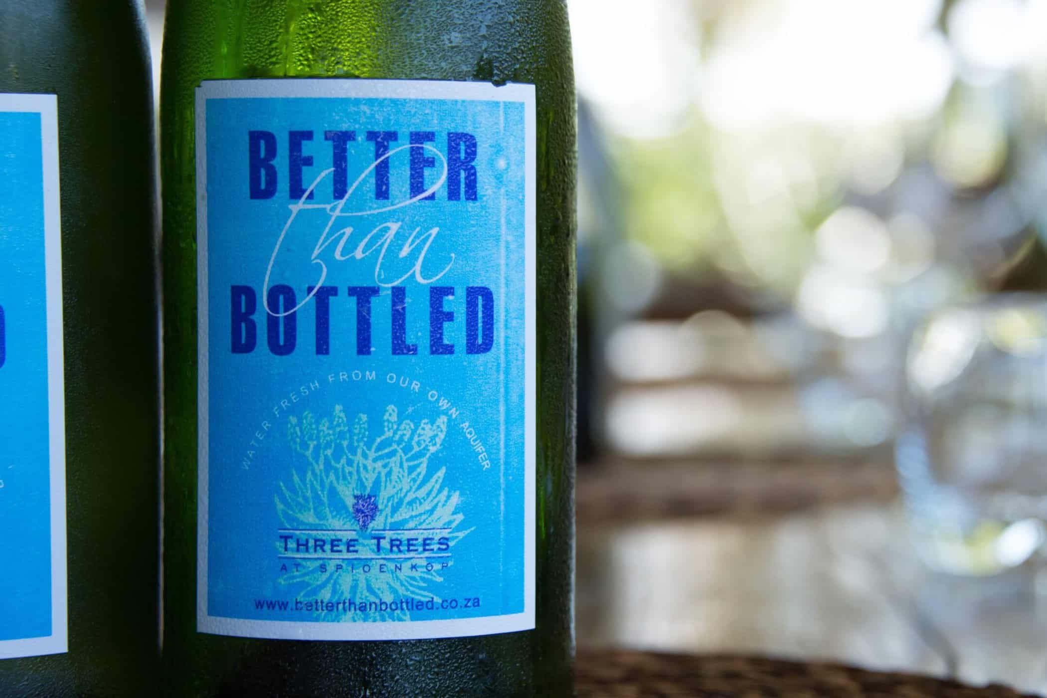 recycled wine bottles being used for water